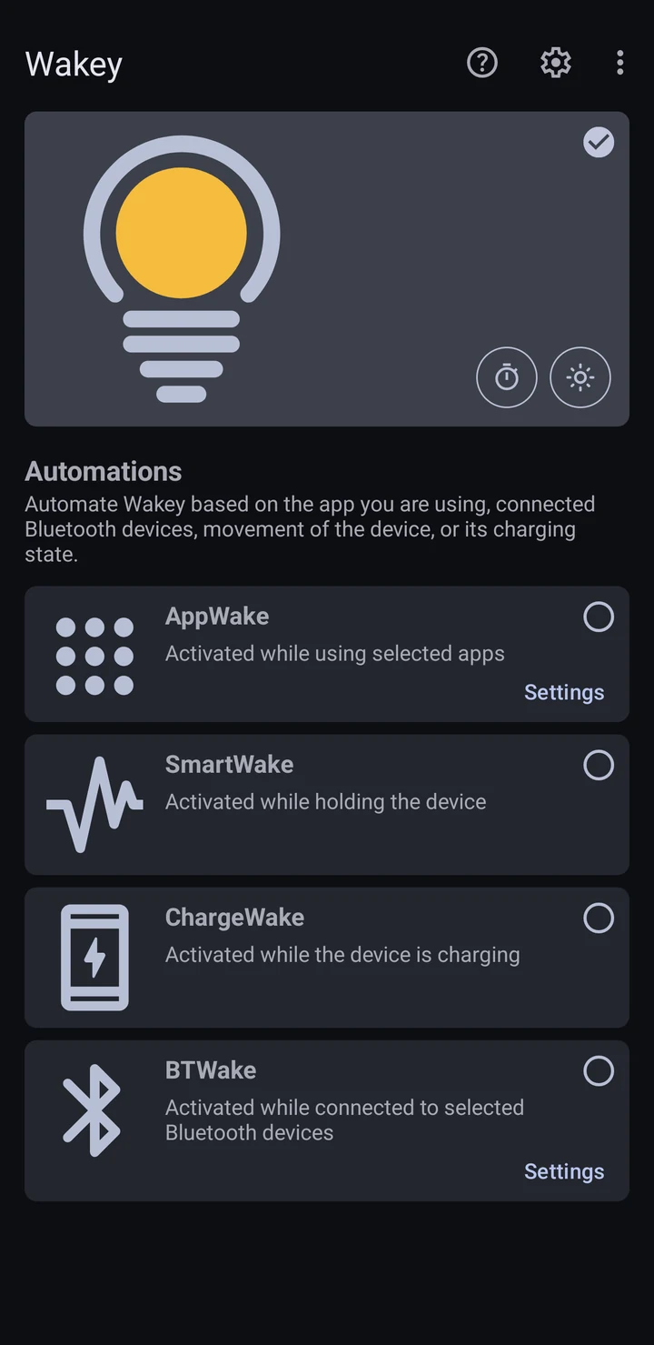 Wakey's main screen in dark theme: the bulb is switched on, with AppWake, SmartWake, ChargeWake and BTWake listed underneath.